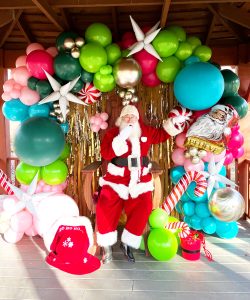 Full Wrap Balloons Santa in front of Gold Streamer Wall by Just Peachy, Little Rock, Arkansas