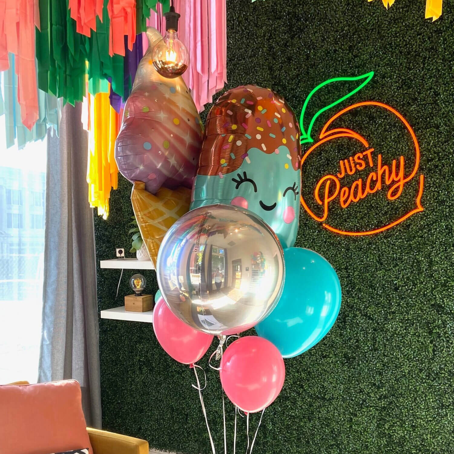 Oversized helium bouquet with ice cream cone, popsicle, and shiny orb balloons from Just Peachy in Little Rock, Arkansas.
