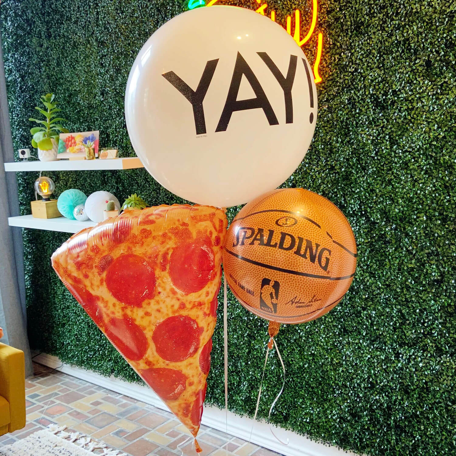 Let’s celebrate with a helium pizza balloon, giant YAY! balloon, and a basketball or baseball balloon, as well as 3 coordinating 11 in. latex balloons.