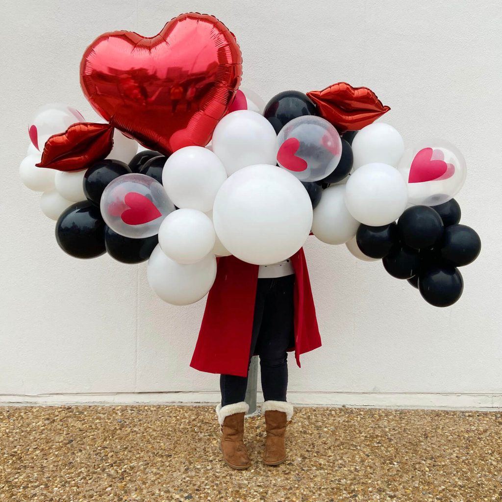Black, white, and red heart balloon garland for Valentine’s Day from Just Peachy.