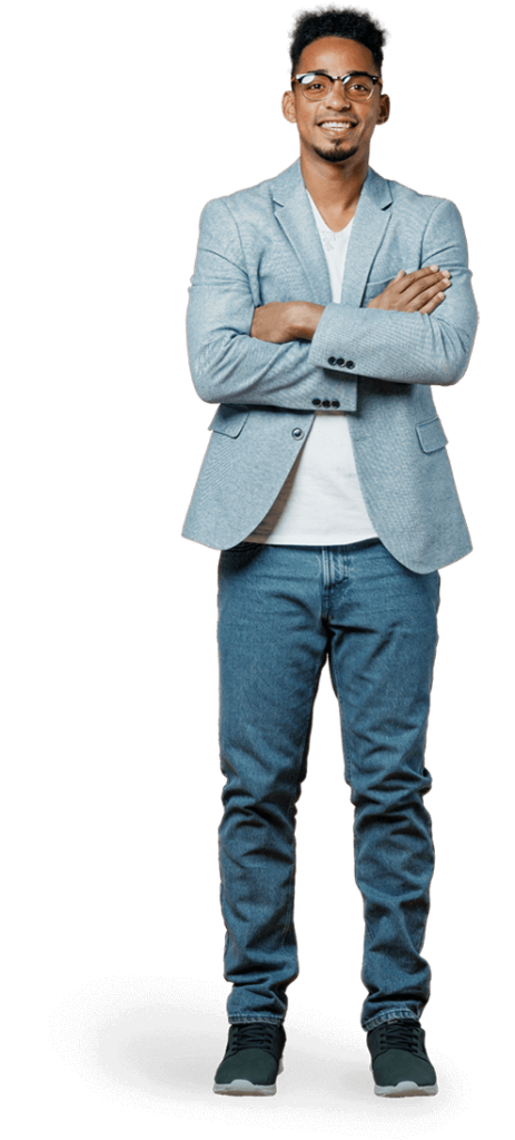 Black man standing in blazer and jeans